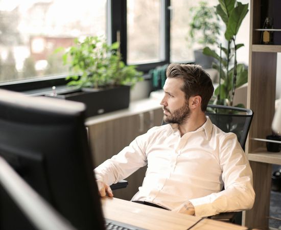 Man looking energetic and focused in an office setting