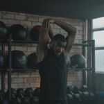 Man stretching arms during break